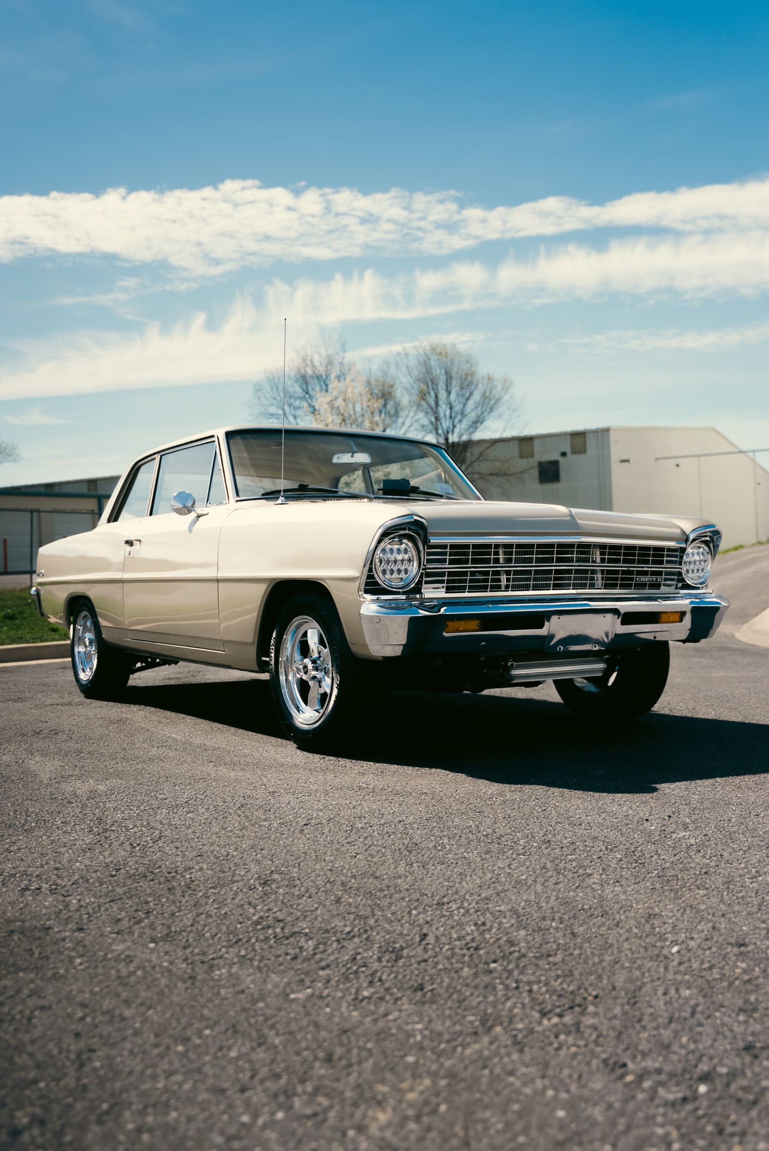 Cream classic Chevrolet Nova in the sun