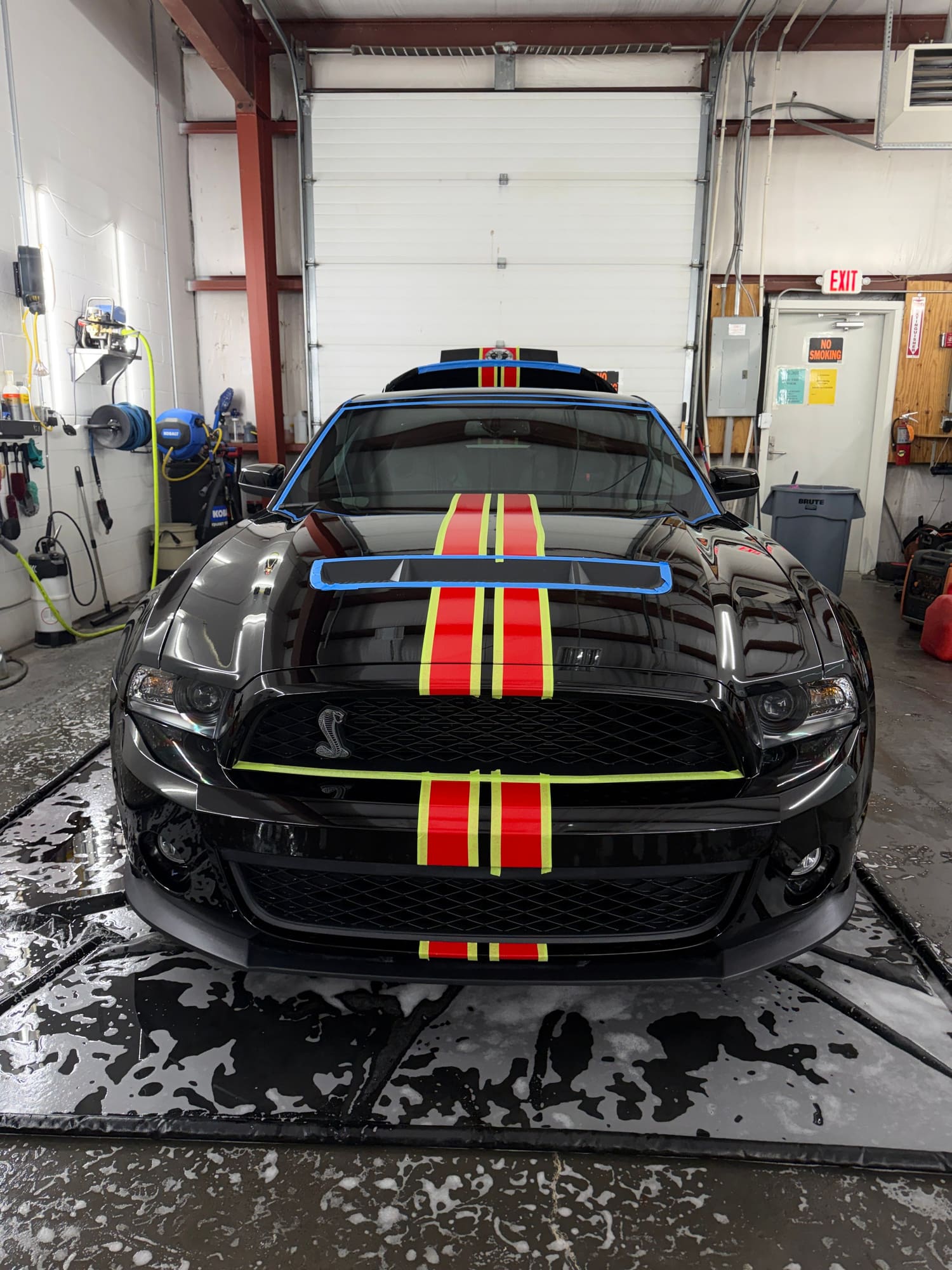 A black Ford Mustang Shelby GT500 getting prep for a 3 stage paint correction and ceramic coating.