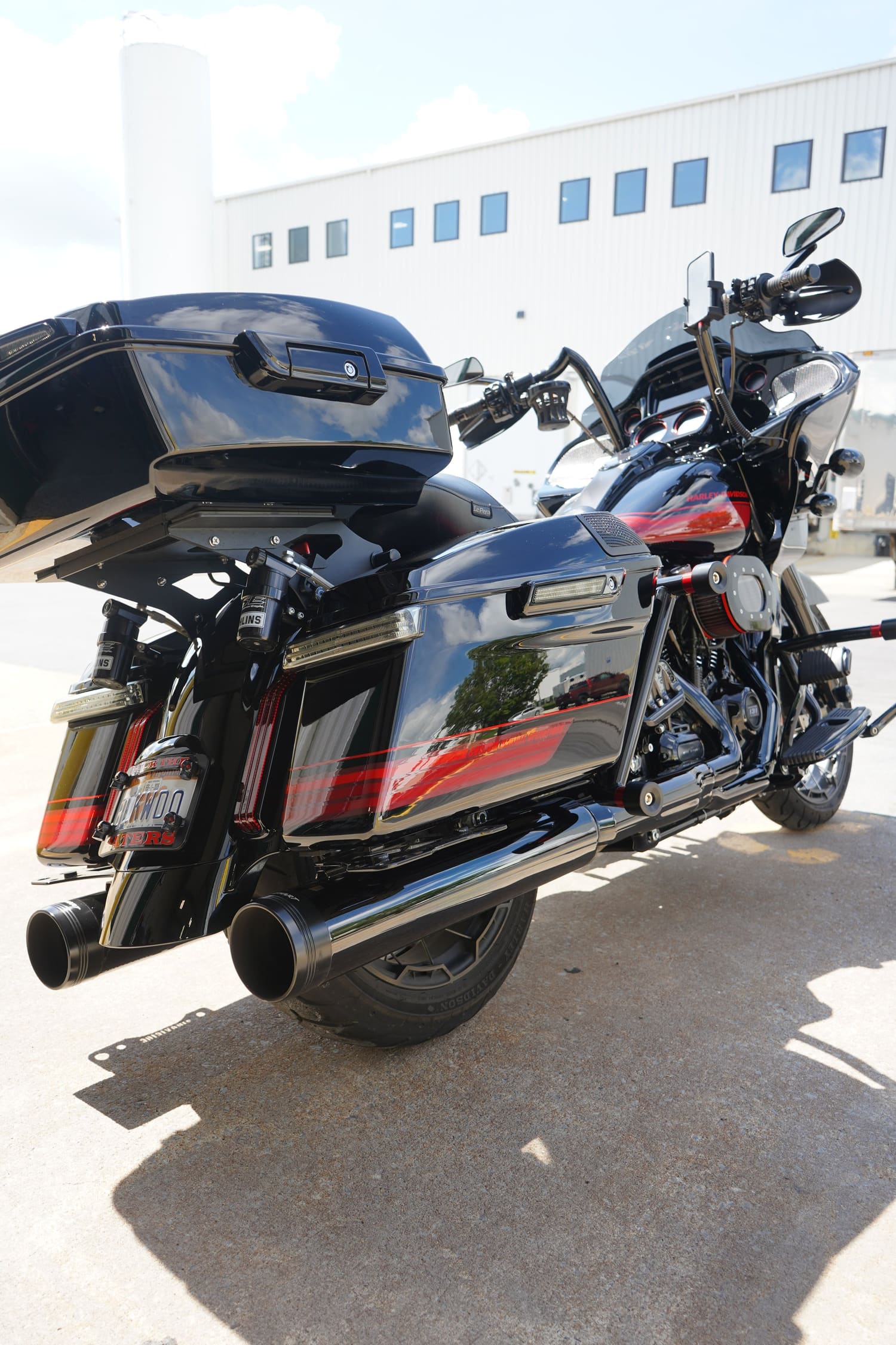 Black touring motorcycle with saddlebags and top case