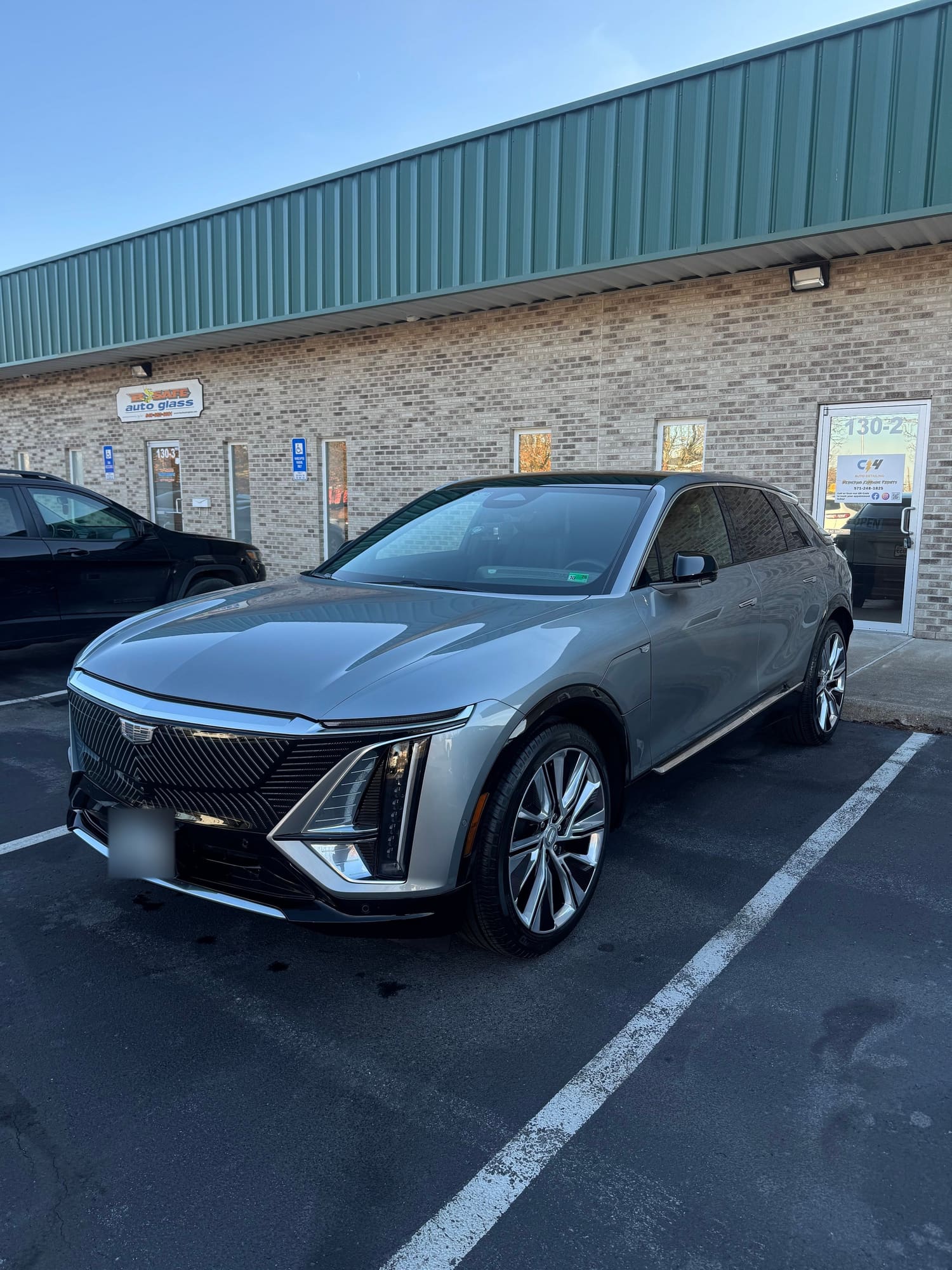 Gray Cadillac Lyriq parked outside the C4 shop