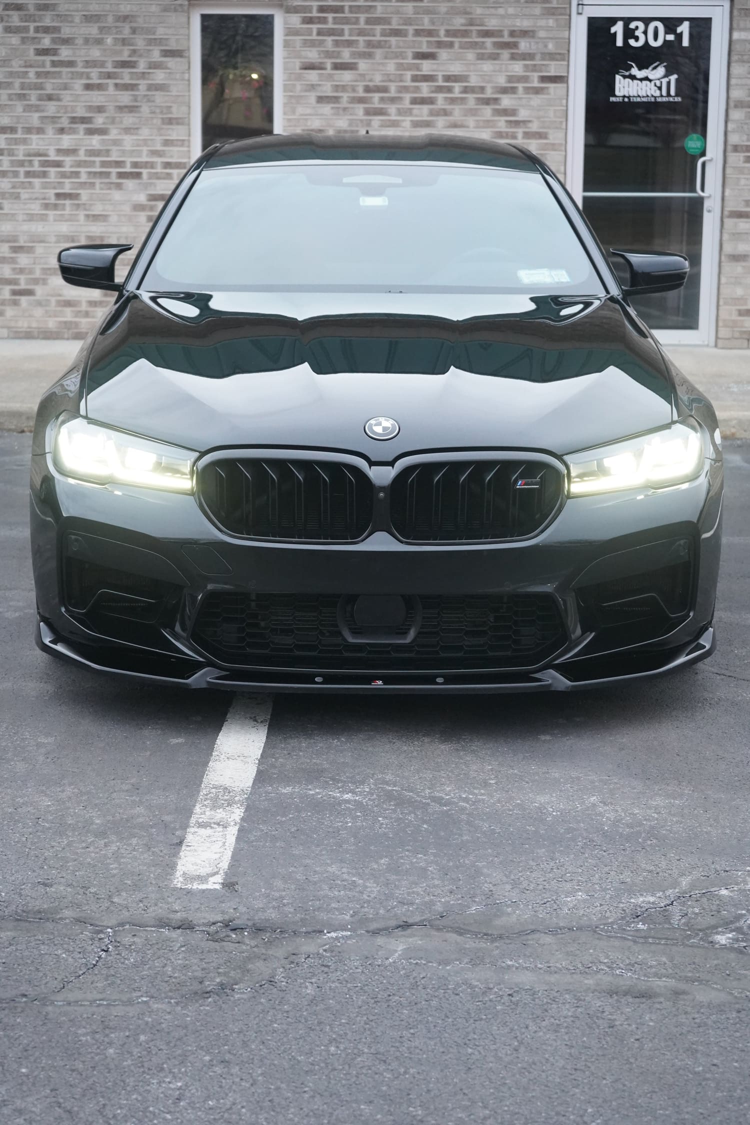 Black BMW M5 front view in the C4 lot